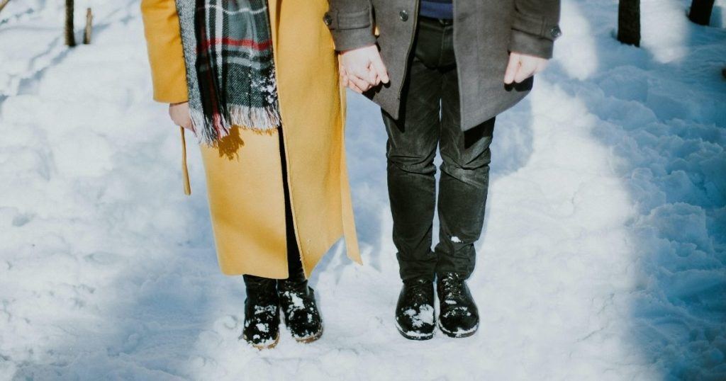 Couple Standing In The Snow