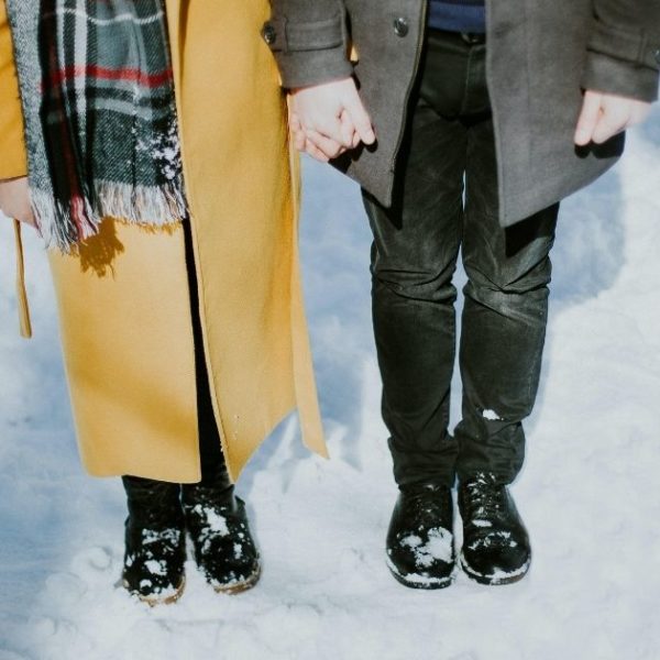 Couple Standing In The Snow
